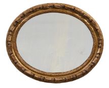 A PAIR OF ITALIAN CARVED GILTWOOD OVAL WALL MIRRORS, LATE 18TH/EARLY 19TH CENTURY