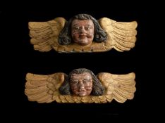 A PAIR OF CARVED, PAINTED AND GILDED WINGED ANGEL ORNAMENTS, LATE 17TH/EARLY 18TH CENTURY