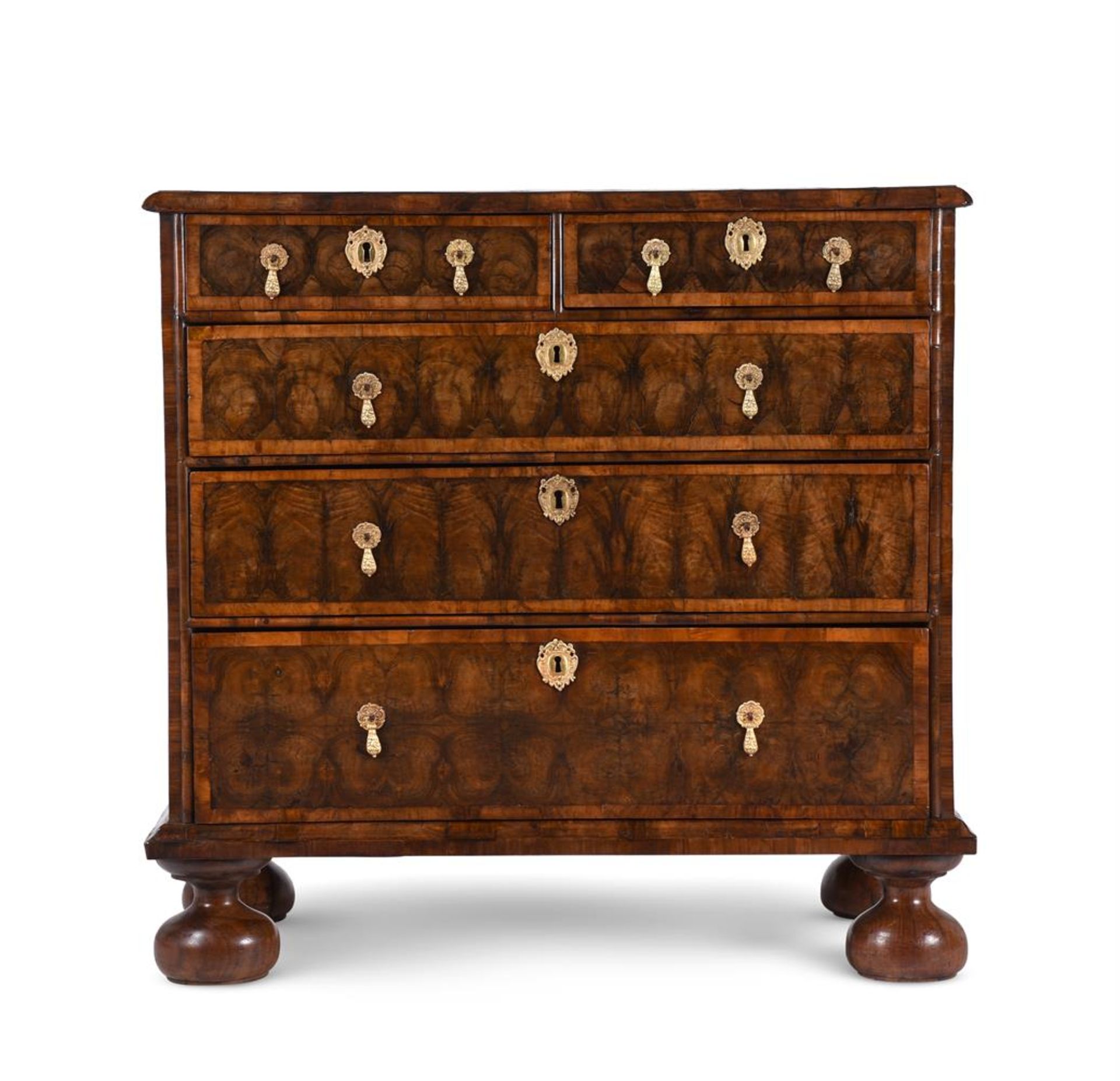 A WILLIAM & MARY OLIVEWOOD OYSTER VENEERED CHEST OF DRAWERS, CIRCA 1690