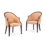 A PAIR OF GEORGE III MAHOGANY AND UPHOLSTERED LIBRARY ARMCHAIRS, IN THE MANNER OF HEPPLEWHITE