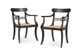 A PAIR REGENCY EBONISED AND GILT DECORATED OPEN ARMCHAIRS, CIRCA 1815
