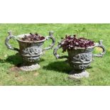 A PAIR OF LEAD TWIN HANDLED URNS, 20TH CENTURY