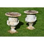 A PAIR OF HANDYSIDE PATTERN CAST IRON GARDEN URNS, 19TH CENTURY