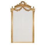 A LARGE CARVED GILTWOOD WALL MIRROR, IN LOUIS XVI STYLE, SECOND HALF 19TH CENTURY