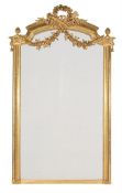 A LARGE CARVED GILTWOOD WALL MIRROR, IN LOUIS XVI STYLE, SECOND HALF 19TH CENTURY