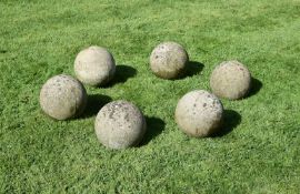 A SET OF SIX STONE COMPOSITION BALLS, 20TH CENTURY