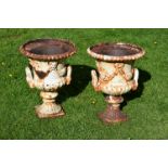 A PAIR OF HANDYSIDE PATTERN CAST IRON GARDEN URNS, 19TH CENTURY