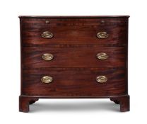 A LATE GEORGE III MAHOGANY AND 'PLUM PUDDING' MAHOGANY COMMODE, CIRCA 1810