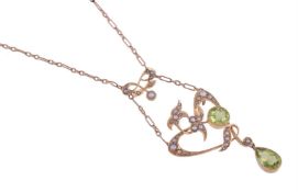AN EDWARDIAN PERIDOT AND SEED PEARL PENDANT NECKLACE CIRCA 1910