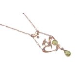 AN EDWARDIAN PERIDOT AND SEED PEARL PENDANT NECKLACE CIRCA 1910