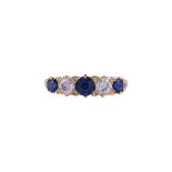 AN EARLY 20TH CENTURY SAPPHIRE AND DIAMOND FIVE STONE RING