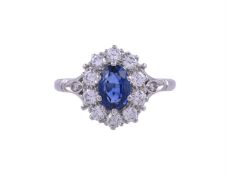 A SAPPHIRE AND DIAMOND CLUSTER RING, LONDON 1981
