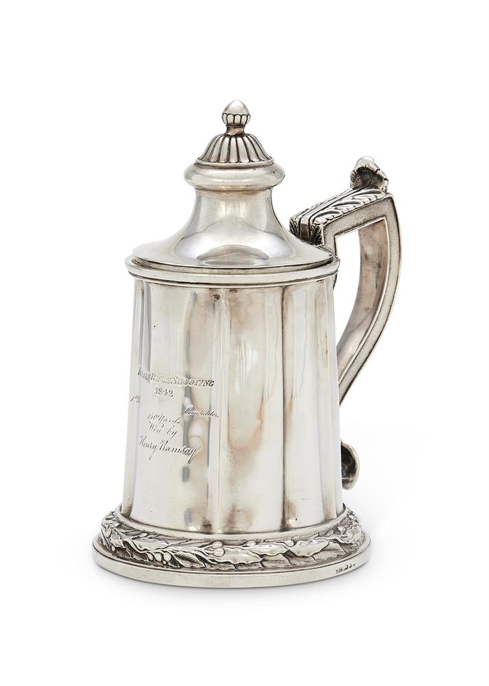 AN INDIAN COLONIAL TANKARD WITH ASSOCIATED PULL OFF COVER