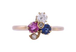 AN EARLY 20TH CENTURY RUBY, SAPPHIRE AND DIAMOND THREE LEAF CLOVER RING