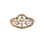 AN ART NOUVEAU DEMANTOID GARNET BROOCH, CIRCA 1910