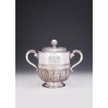 A SILVER TWIN HANDLED CUP AND COVER