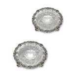 A PAIR OF GEORGE III SILVER SHAPED CIRCULAR SALVERS