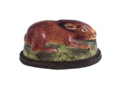 A 19TH CENTURY STAFFORDSHIRE ENAMEL RABBIT BOX