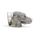 A SILVER COLOURED HOUNDS HEAD STIRRUP CUP