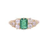 A LATE VICTORIAN EMERALD AND DIAMOND SEVEN STONE RING CIRCA 1900