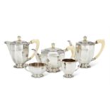 Y A CASED SILVER FIVE PIECE CIRCULAR FLUTED TEA AND COFFEE SET