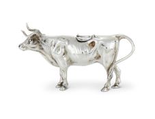 AN EDWARDIAN SILVER COW CREAMER