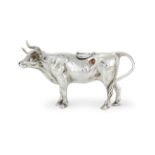 AN EDWARDIAN SILVER COW CREAMER