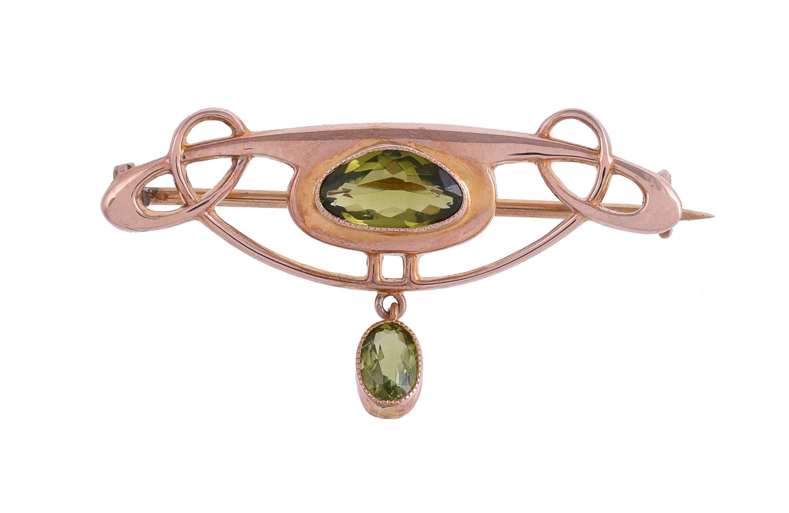 BARNET HENRY JOSEPH, A PERIDOT ARTS AND CRAFTS BROOCH, CIRCA 1905