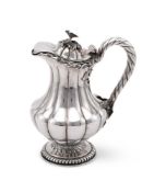 AN INDIAN COLONIAL SILVER BALUSTER JUG