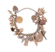 A GOLD COLOURED CHARM BRACELET