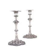A PAIR OF GEORGE III SILVER CAST CANDLESTICKS