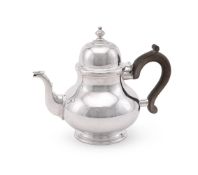 A SILVER BALUSTER TEA POT