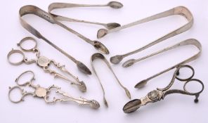 A COLLECTION OF SILVER SUGAR TONGS
