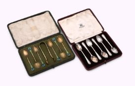 A NORWEGIAN SET OF SIX SILVER GILT AND ENAMEL TEA SPOONS AND A PAIR OF SUGAR TONGS