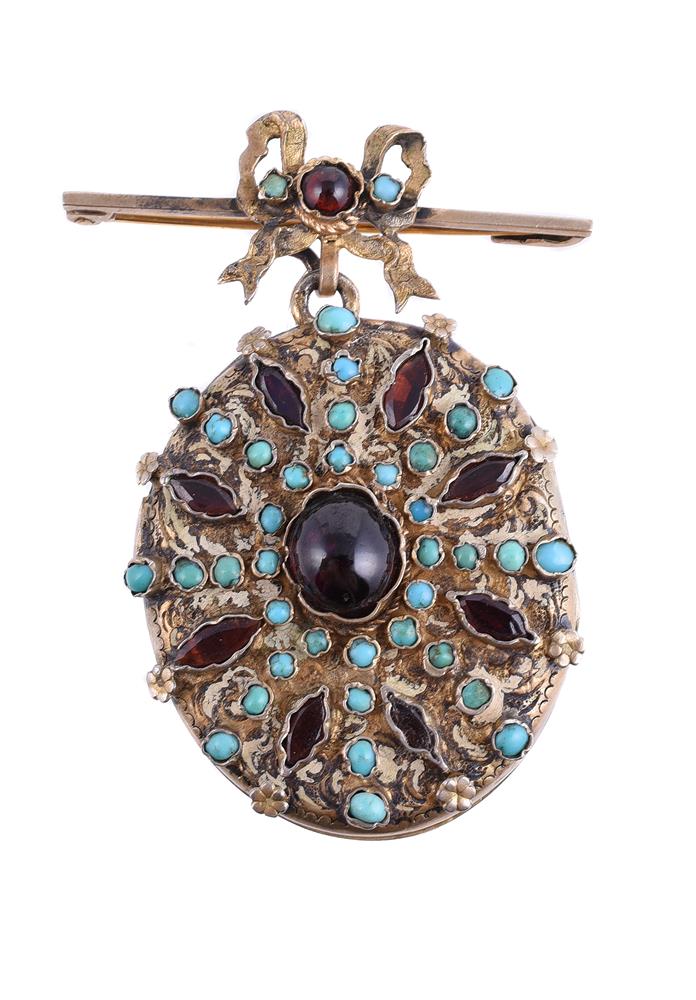 AN EARLY 20TH CENTURY AUSTRO HUNGARIAN GARNET AND TURQUOISE LOCKET PENDANT