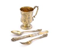 A CASED VICTORIAN SILVER GILT CUP, KNIFE, FORK AND SPOON