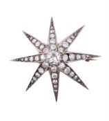 A DIAMOND STAR BROOCH