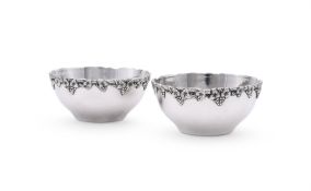 A PAIR OF SILVER COLOURED BOWLS