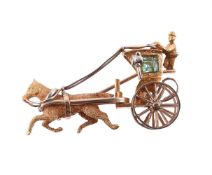 A 1980S EMERALD HORSE AND CARRIAGE BROOCH, CIRCA 1981