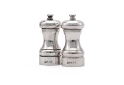 A PAIR OF SILVER PEPPER GRINDERS