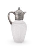 A VICTORIAN SILVER MOUNTED AND CUT GLASS CLARET JUG