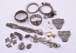 A COLLECTION OF VICTORIAN AND LATER SILVER COLOURED JEWELLERY