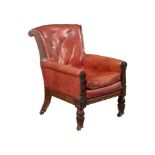 A WILLIAM IV CARVED MAHOGANY LIBRARY ARMCHAIR
