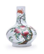 A CHINESE FAMILLE ROSE 'NINE PEACHES' BOTTLE VASE