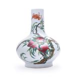 A CHINESE FAMILLE ROSE 'NINE PEACHES' BOTTLE VASE