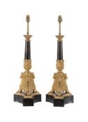 A PAIR OF GILT AND PATINATED METAL TABLE LAMPS IN EMPIRE STYLE