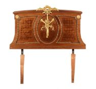 A FRENCH WALNUT PARQUETRY AND GILT METAL MOUNTED SINGLE HEADBOARD