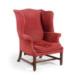 A GEORGE III MAHOGANY WING ARMCHAIR