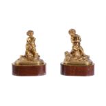 A PAIR OF GILT BRONZE MODELS OF PUTTI