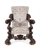 AN ITALIAN CARVED WALNUT AND UPHOLSTERED ARMCHAIR